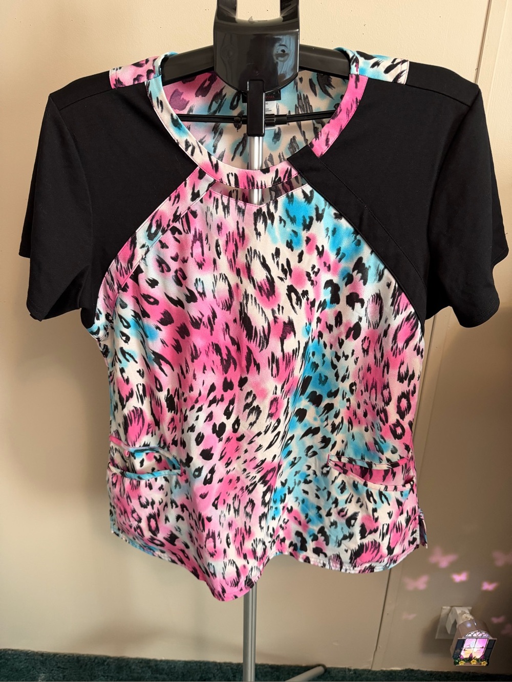 Colorful Leopard Print Scrub Top with Black Raglan Sleeves by careisma